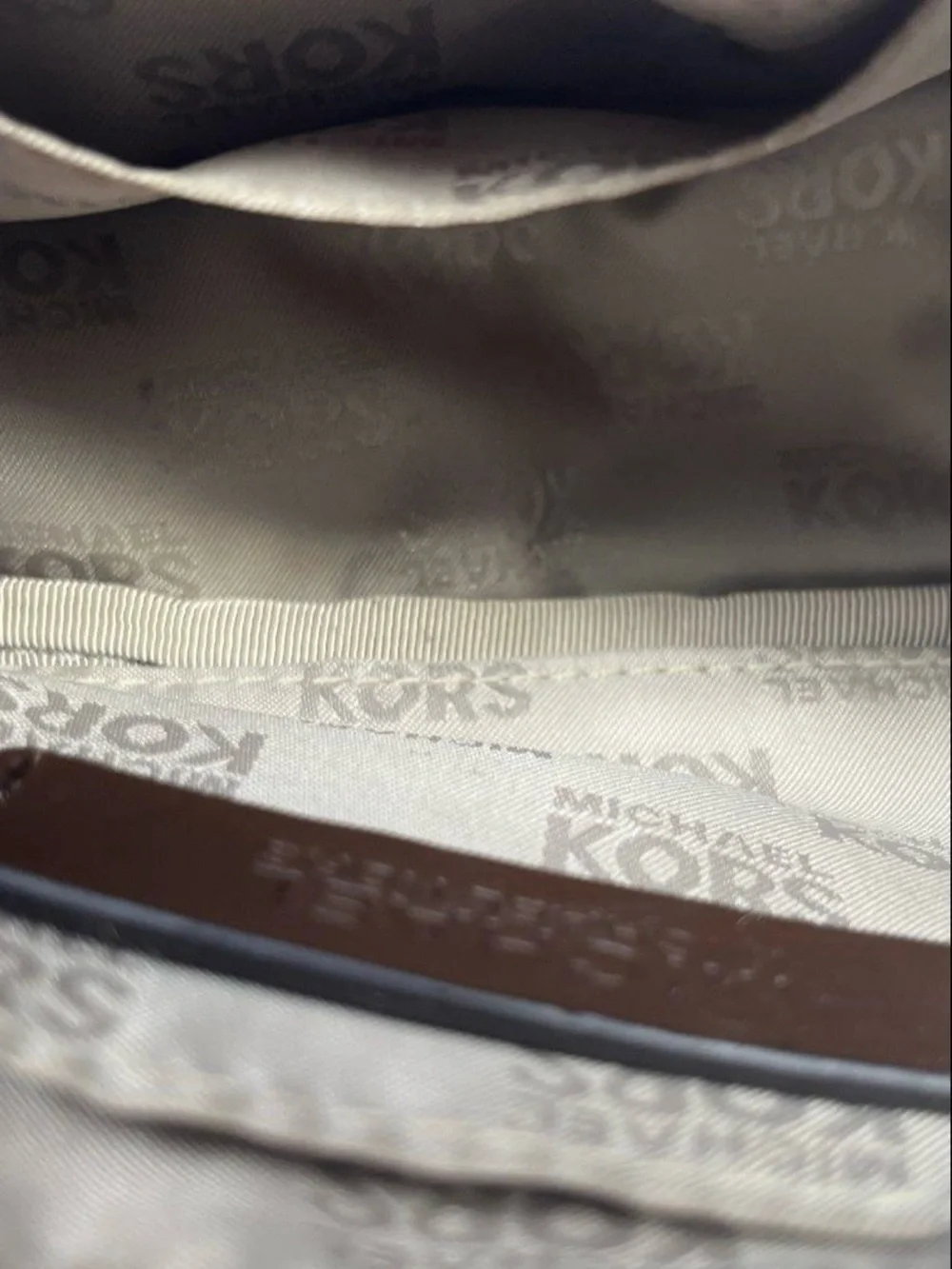 Michael Kors Brown and Tan Signature MK Wristlet with Gold Plate